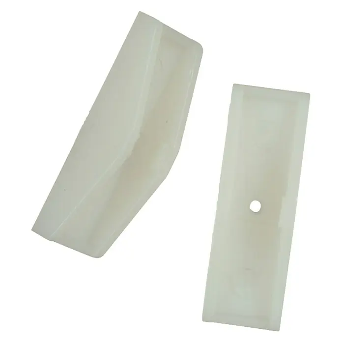Connex Mordaza de prensado COXT220050 - Acero - Dos guías deslizantes de plástico blanco diseñadas para un movimiento suave y reducción del desgaste en sistemas mecánicos.