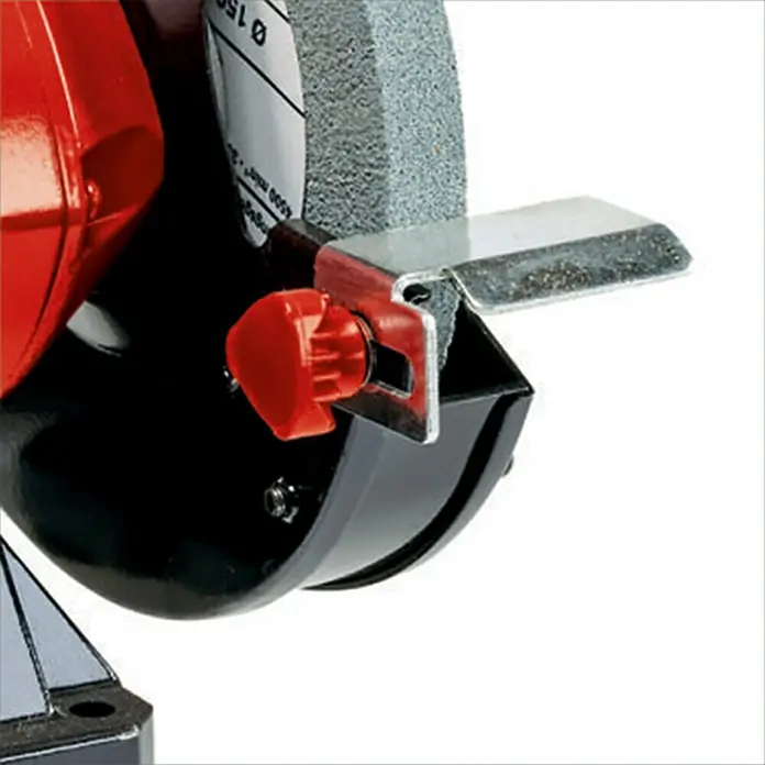 Einhell Esmeriladora doble eléctrica TC-BG 150 - 150 W, 2.980 r.p.m. - Primer plano de una amoladora de banco con un botón rojo y una muela abrasiva.