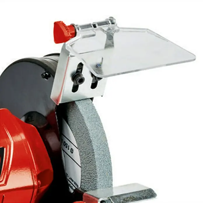 Einhell Esmeriladora doble eléctrica TC-BG 150 - 150 W, 2.980 r.p.m. - Primer plano de una amoladora con protección. El aparato es rojo, negro y gris, diseñado para tareas de esmerilado.