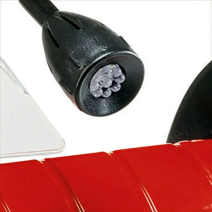 Einhell Esmeriladora doble eléctrica TC-BG 200 L - 400 W, 2.980 r.p.m. - Primer plano de una lámpara LED con carcasa negra y base roja. La lámpara está enfocada en iluminar un área específica.