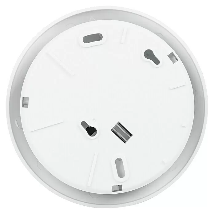 Homematic IP Sistema de alarma HmIP-ASIR-2 -  - Base circular de plástico blanco de una alarma o detector, mostrando ranuras y orificios de montaje.