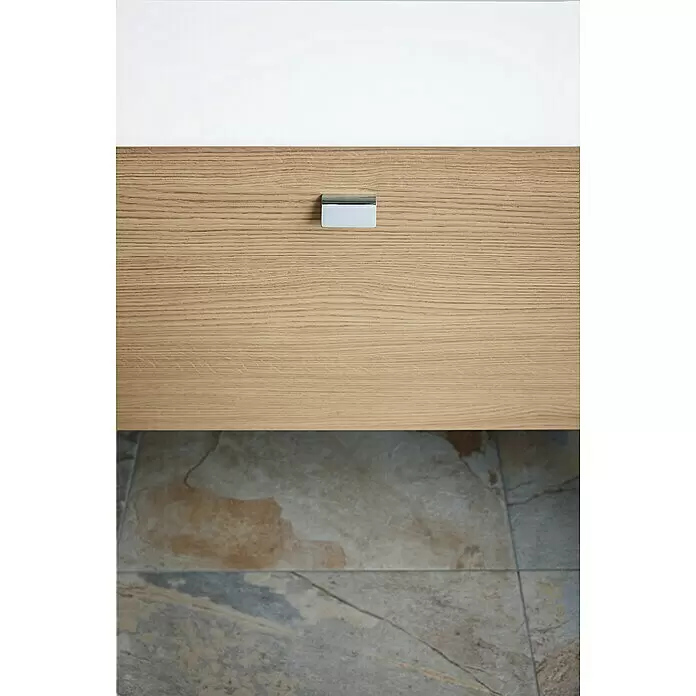 Duravit Vero Air Waschtisch - 100 x 47 cm, Ohne Spezialglasur, Hahnloch: Ohne, Ohne Überlauf, Weiß, Geschliffen - Nahaufnahme einer hellen Holzschubladenfront mit silbernem Griff, über einem gefliesten Boden.