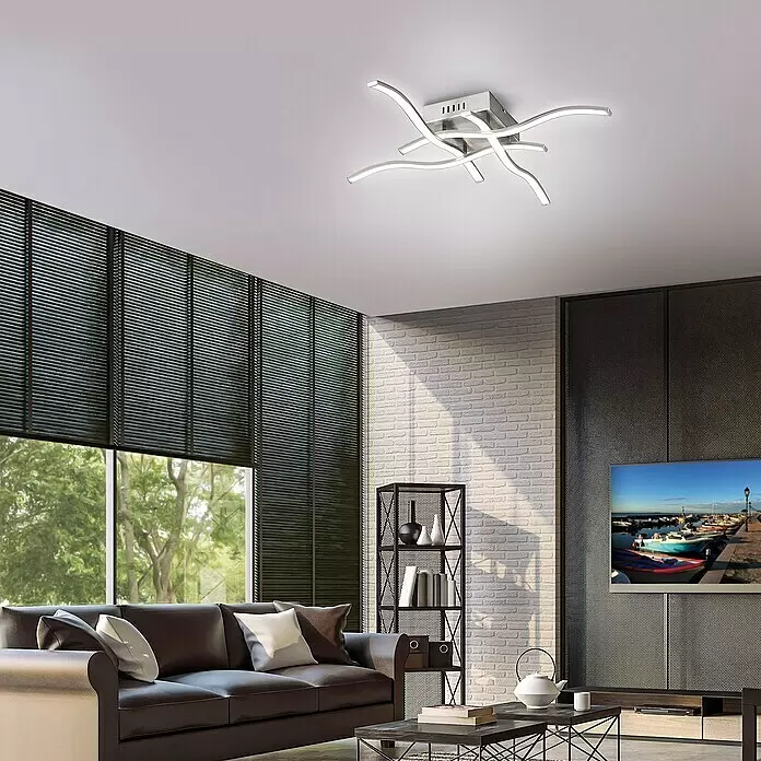 Just Light Wave LED-Deckenleuchte - 19,2 W, L x B x H: 550 x 550 x 90 mm, Stahl, Warmweiß - Moderne Deckenleuchte mit fünf geschwungenen LED-Armen und gebürsteter Metallbasis, beleuchtet ein Wohnzimmer.