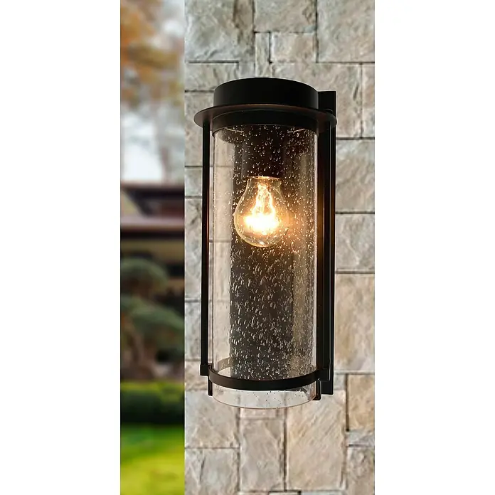 Starlux Außenwandleuchte Elmo - 10 W, 17 x 12 x 33 cm, Anthrazit/Weiß, IP44 - Nahaufnahme einer dekorativen Außenwandleuchte mit einer klaren, strukturierten Glasabdeckung und einer warm leuchtenden Edison-Glühbirne.