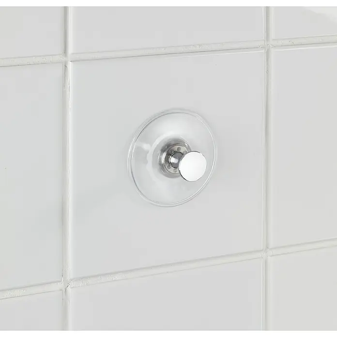 Wenko Saugnapf-Haken Arezzo - 1 Stk., Kunststoff, Transparent - Nahaufnahme eines Saugnapf-Hängehakens an weißen Fliesen. Perfekt für Badezimmer oder Küche, bietet er eine einfache und praktische Aufbewahrungslösung.
