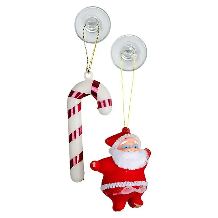 Wenko Saugnapf-Haken - 6 Stk., Kunststoff, Transparent - Weihnachtliche Dekoration mit Zuckerstange und Santa Ornamenten, hängend mit Saugnäpfen an einer schwarzen Oberfläche.