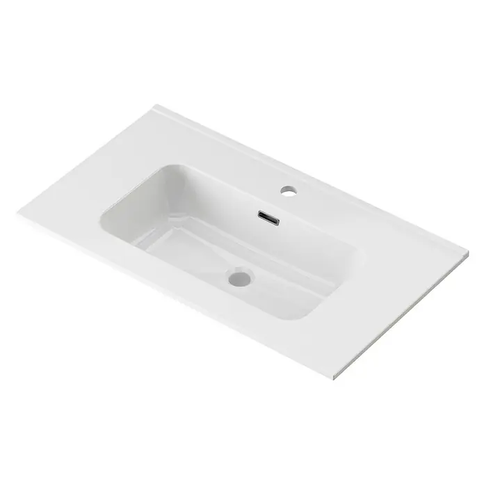 Conjunto de mueble de baño Naomi -  - Un lavabo de cerámica blanca con orificio para grifo y rebosadero. La pila es rectangular con esquinas redondeadas.