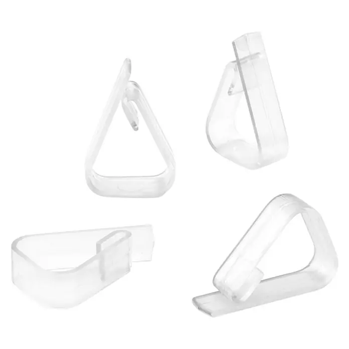 Inofix Pinza sujetamanteles 1190 - 4 ud., Transparente - Primer plano de clips de plástico transparente para manteles, mostrados sobre un fondo negro.