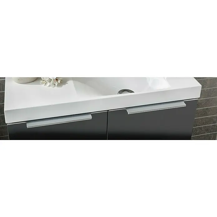 Camargue Fresh Waschtischunterschrank - 59,8 x 22,1 x 60,4 cm, Grafit - Nahaufnahme eines modernen Badezimmerschranks mit Waschbecken und eleganten Griffen. Das Möbelstück ist stilvoll und funktional.