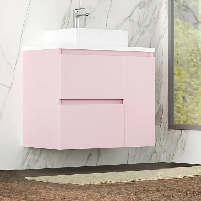 Artysan Mueble bajo de lavabo Farbe - 46 x 70 x 66 cm, Rosa - Imagen de un moderno tocador de baño rosa con encimera blanca y grifo plateado contra una pared de mármol.