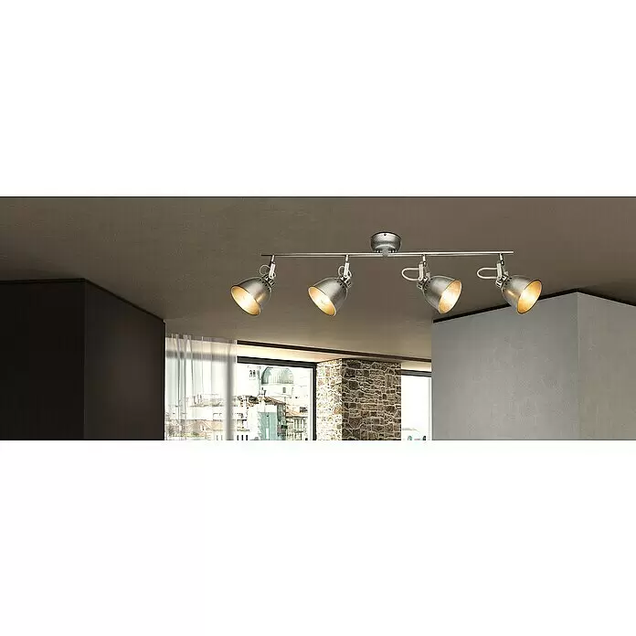 Tween Light Deckenstrahler Industry - 160 W, E14 - Silberfarbene Vier-Spot-Schiene an strukturierter Decke, beleuchtet einen modernen Raum.
