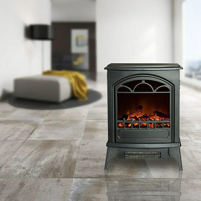 Voltomat HEATING Chimenea eléctrica Lisboa - 1.950 W, Negro, 24 x 39 x 56,5 cm - Primer plano de un calentador de chimenea eléctrico en una sala de estar elegante, creando un ambiente acogedor.