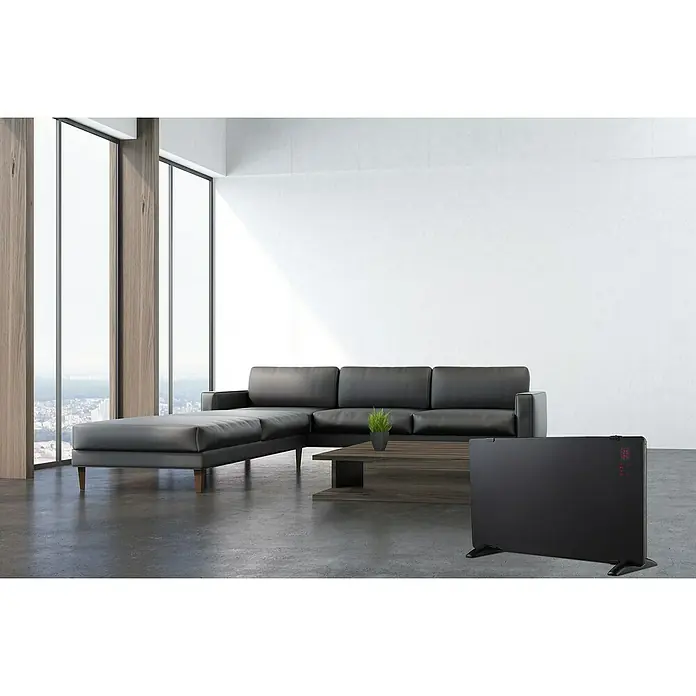 Voltomat HEATING Konvektorheizung - 2.000 W, Raumgröße bis ca. 20 m², Schwarz - Ein modernes Wohnzimmer mit einem stilvollen schwarzen Sofa und einem eleganten, digitalen Heizgerät im Vordergrund.