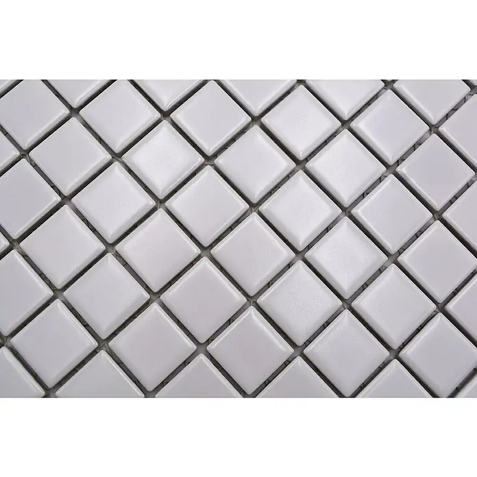 Mosaikfliese Quadrat Uni CG 114 - 29,8 x 29,8 cm, Weiß, Matt - Nahaufnahme eines Musters aus quadratischen, weißen Mosaikfliesen mit Fugen. Ein schlichtes, elegantes Design für Wand- oder Bodengestaltung.