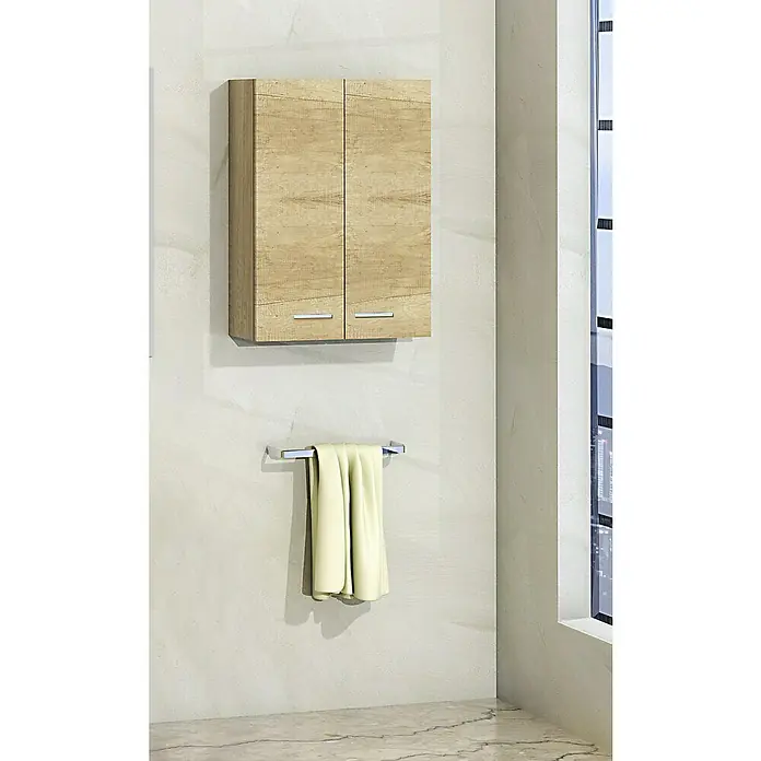 Artysan Armario colgante de baño Miami - L x An x Al: 21 x 54 x 74 cm, Olmo - Armario de baño con toallero y una toalla de color claro. El armario es de madera clara y tiene dos puertas con tiradores plateados.