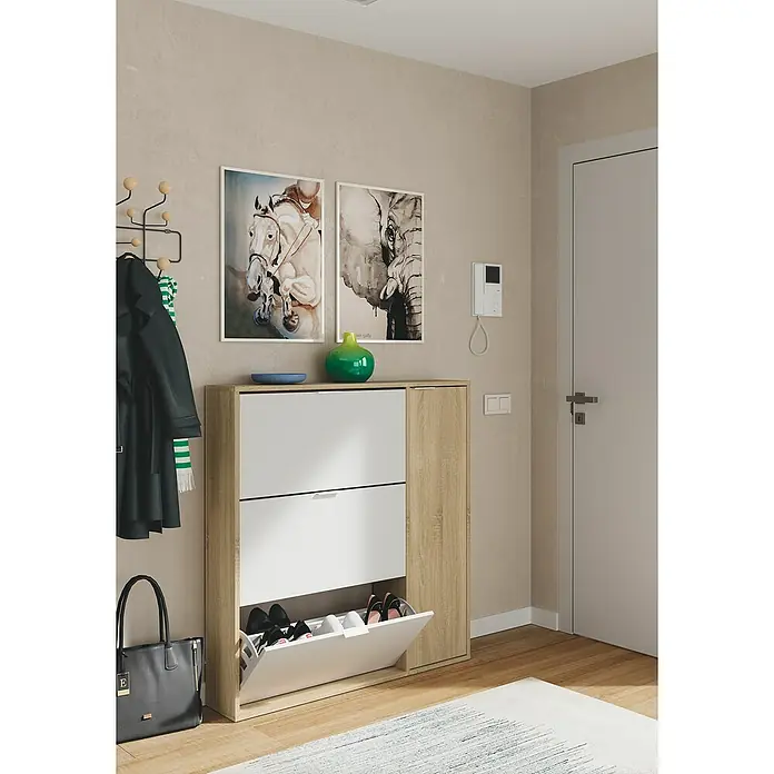 Zapatero Class - L x An x Al: 22 x 106 x 115 cm, Blanco/Roble - Zapatero de madera y blanco con dos cajones y compartimento abierto para zapatos en el pasillo con decoraciones y cuadros en la pared.