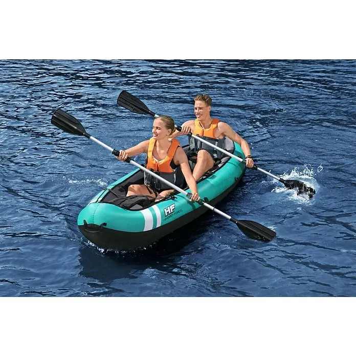 Bestway Hydro Force Kayak Ventura X2 - Plástico, Turquesa/Negro - Un kayak turquesa Hydro-Force con dos personas remando en el agua, ofreciendo una excelente experiencia recreativa al aire libre.