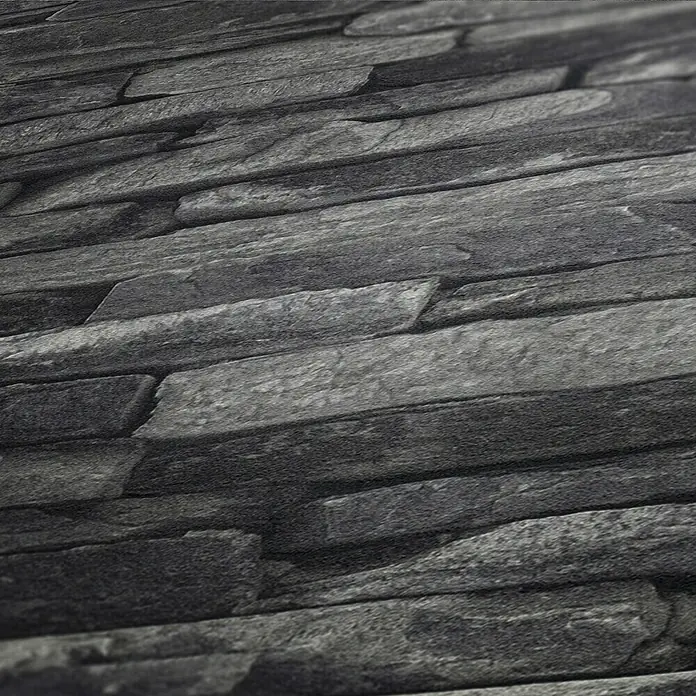 A.S. Création Elements Vliestapete Bruchsteinmauer - Grau/Schwarz, Steinoptik, 10,05 x 0,53 m - Nahaufnahme einer grauen Schieferwand, die Textur und Tiefe des Materials hervorhebt.