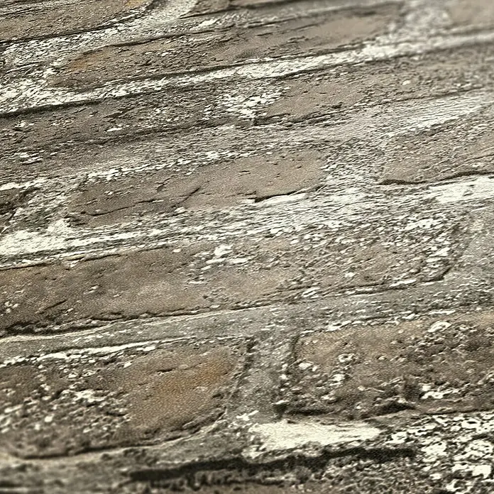 A.S. Création Elements Vliestapete Backsteinmauer - Beige/Grau, Steinoptik, 10,05 x 0,53 m - Nahaufnahme einer grauen, mit weißer Farbe abgenutzten Ziegelwand. Die Textur ist rau und die Farben sind kontrastreich.
