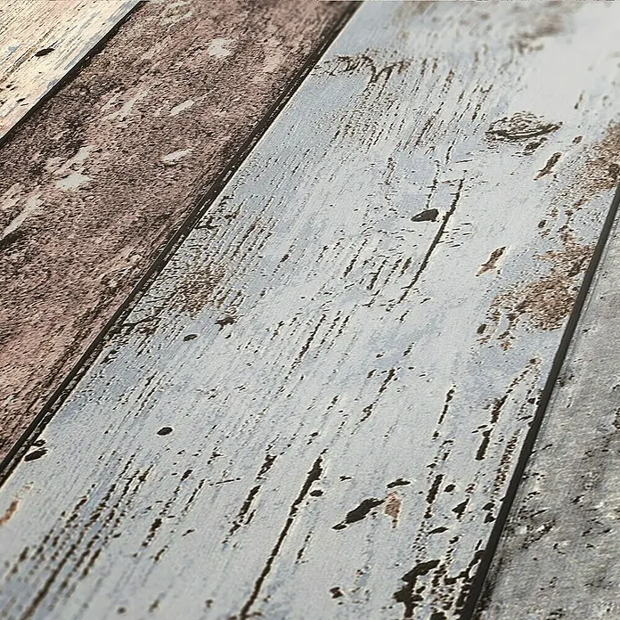 A.S. Création Elements Vliestapete - Braun/Blau/Beige, Holzoptik, 10,05 x 0,53 m - Nahaufnahme von strukturierten Holzpaneelen in verwitterten Farben. Die Dielen haben ein abgenutztes Aussehen, das an Vintage- oder Bauernhausstil erinnert.