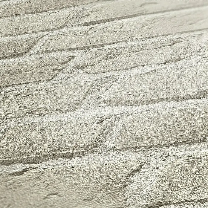 A.S. Création Elements Vliestapete Backsteinmauer II - Steingrau, Steinoptik, 10,05 x 0,53 m - Nahaufnahme einer weißen Backsteintapete mit realistischer Textur, die eine rustikale und moderne Ästhetik vereint.\n