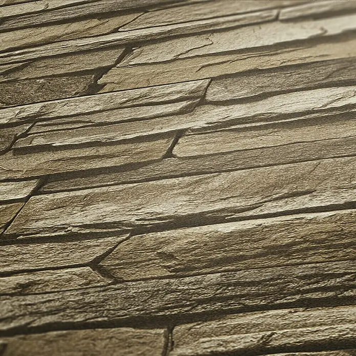 A.S. Création Elements Vliestapete Mauersteine - Braun/Beige, Steinoptik, 10,05 x 0,53 m - Nahaufnahme einer Wand mit dekorativen Steinverblendern, die eine natürliche und rustikale Ästhetik erzeugen.