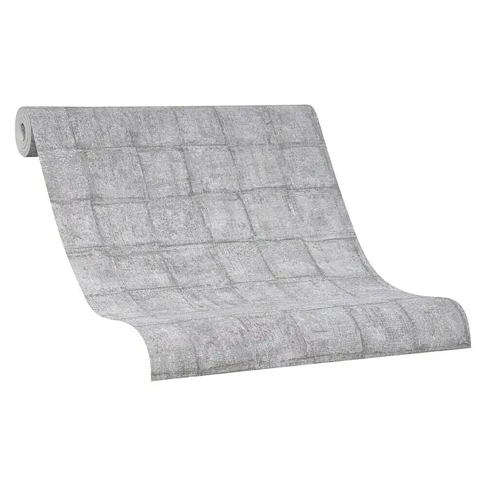 Marburg Casual Vliestapete Karomuster - Braun/Grau, Grafisch, 10,05 x 0,53 m - Nahaufnahme einer Rolle grauer Backsteintapete mit detaillierter Textur und natürlichem Look. Ideal, um jedem Raum einen Hauch von Industrie-Chic zu verleihen.