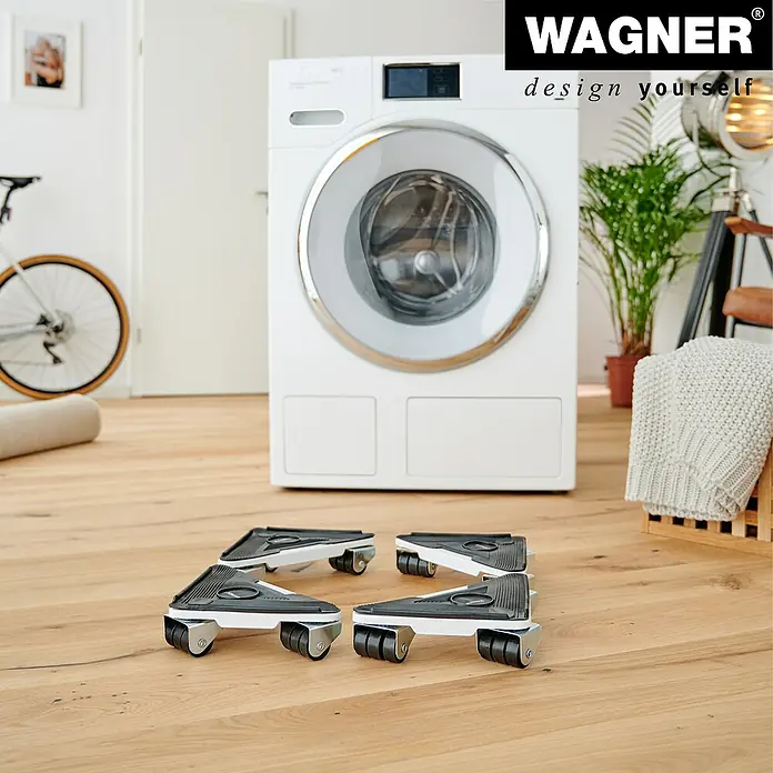 Wagner System Transportroller MM 1191 - L x B x H: 230 x 170 x 50 mm, Traglast: 250 kg, Stahl - Das Bild zeigt vier Wagner Möbelroller vor einer Waschmaschine, die das Bewegen schwerer Geräte erleichtern. Ideal für flexible Haushaltsgestaltung.
