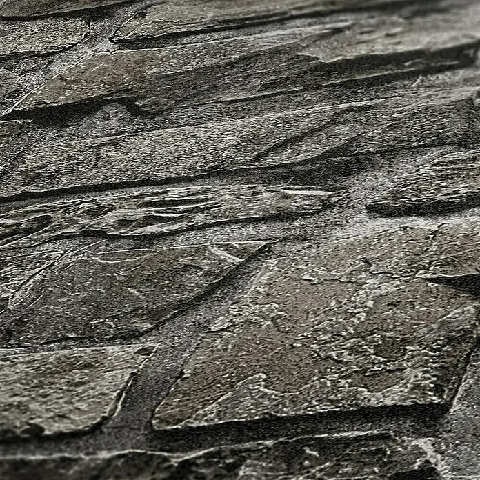 A.S. Création Il Decoro Vliestapete Steine - Anthrazit, Steinoptik, 10,05 x 0,53 m - Nahaufnahme einer grauen Steinmauer mit rauher Textur, ideal für Hintergründe und Designprojekte. Die Oberfläche zeigt vielfältige Details und Schattierungen.