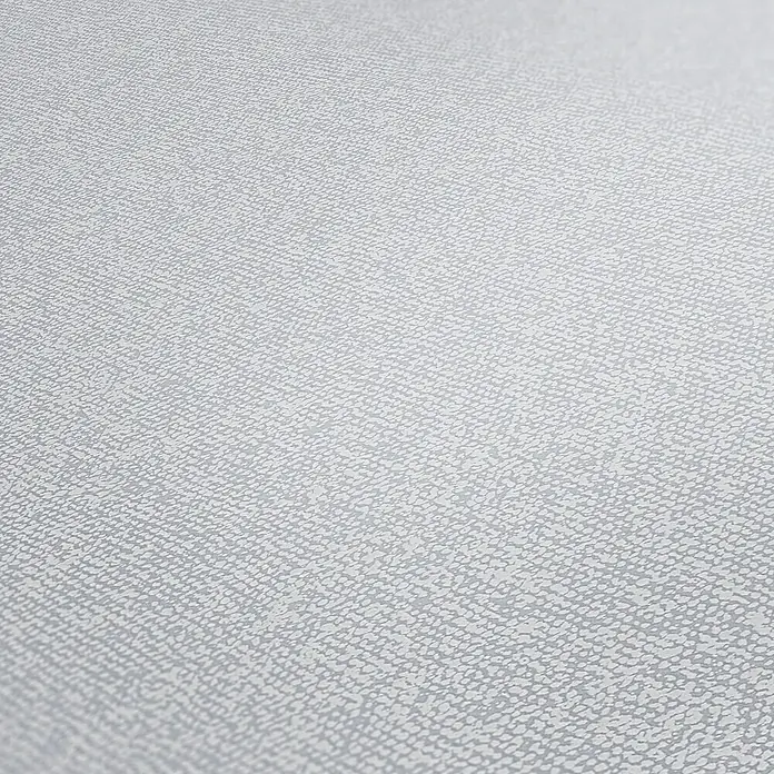 A.S. Création New Elegance Vliestapete I - Hellgrau, Uni, 10,05 x 0,53 m - Nahaufnahme eines grauen texturierten Hintergrunds, ideal für subtile und elegante Designs mit Stoffähnlicher Oberfläche.