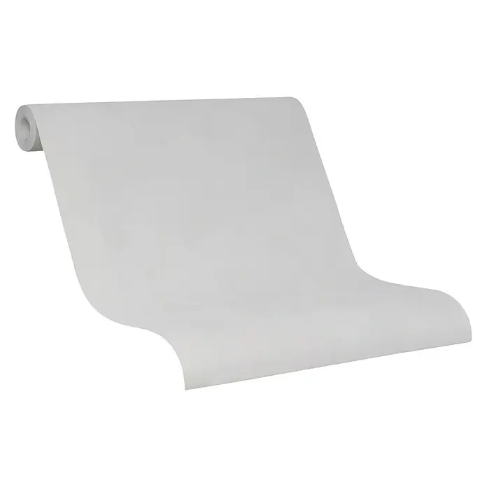 SCHÖNER WOHNEN-Kollektion Vliestapete - Greige, Uni, 10,05 x 0,53 m - Nahaufnahme einer Rolle weißer Tapete vor einem neutralen Hintergrund, die Textur und das Volumen des Produkts hervorhebt.