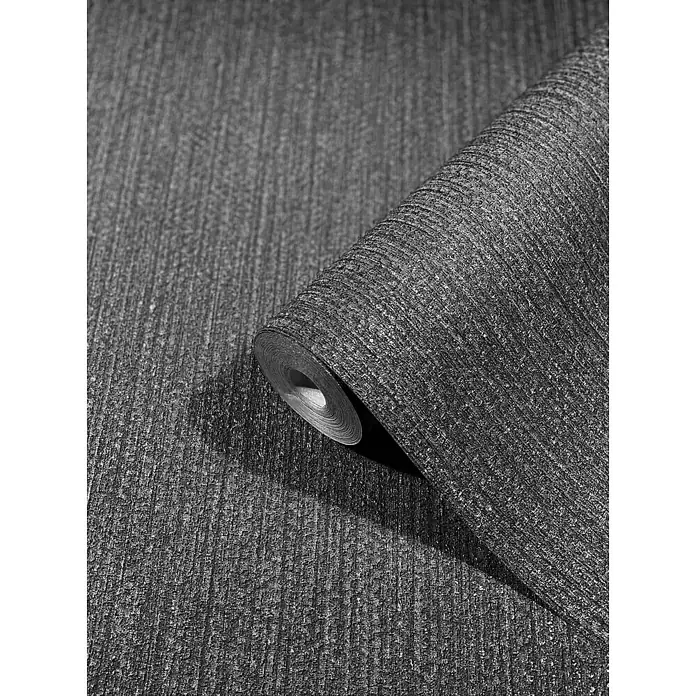 SCHÖNER WOHNEN-Kollektion New Spirit Vliestapete Struktur - Anthrazit, Uni, 10,05 x 0,53 m - Nahaufnahme einer Rolle glitzernder, grauer Vliestapete mit einer strukturierten Oberfläche und vertikalen Linien für stilvolle Wände.