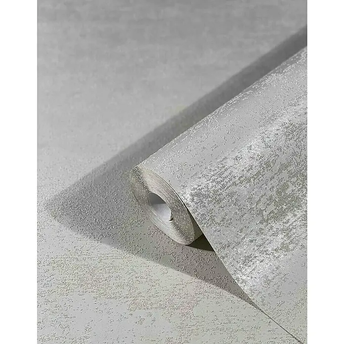Marburg Sand & Stones Vliestapete Dune II - Beige, Uni, 10,05 x 0,53 m - Nahaufnahme einer Rolle silberner, strukturierter Tapete, die ein elegantes, modernes Design für die Inneneinrichtung zeigt.
