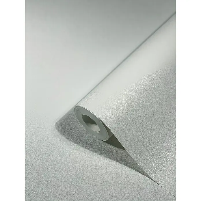 SCHÖNER WOHNEN-Kollektion New Spirit Vliestapete - Schimmerweiß, Uni, 10,05 x 0,53 m - Graue, strukturierte Tapete auf einer Rolle, die eine elegante und moderne Wandgestaltung ermöglicht.