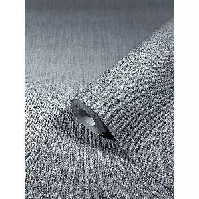 SCHÖNER WOHNEN-Kollektion New Spirit Vliestapete - Strukturgrau, Uni, 10,05 x 0,53 m - Rolle schimmernder grauer Struktur-Tapete, teilweise abgerollt, um ihr funkelndes Leinenmuster zu zeigen.