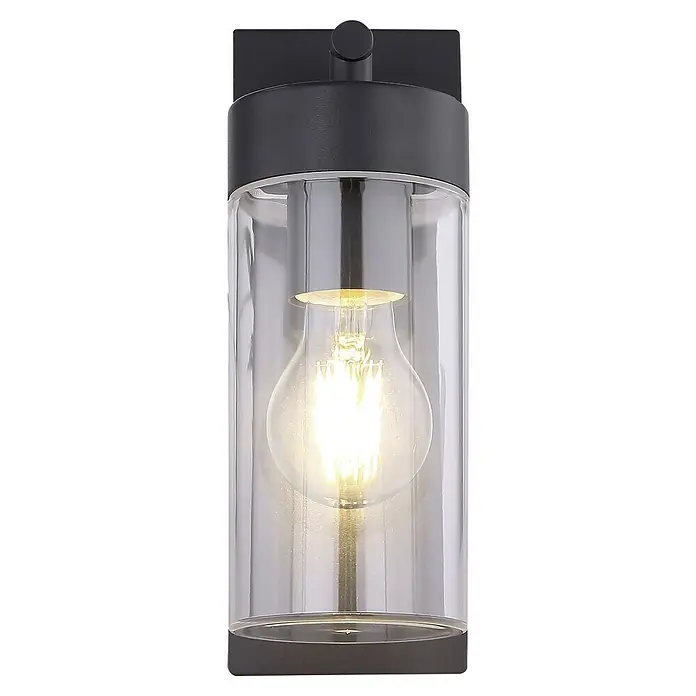Globo Aplique exterior LED Vessa - Negro, Aluminio, E27, An x Al: 8,9 x 25 cm - Primer plano de un aplique de pared con un cilindro de vidrio transparente y una bombilla Edison que emite una luz cálida.