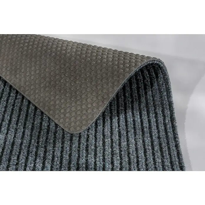 Astra Fußmatte Rib Line Sprint - 40 x 60 cm, Grau, 100 % Polypropylen - Detailansicht einer grauen Fußmatte mit gerippter Oberfläche und rutschfester Unterseite, ideal für den Innenbereich und zur Schmutzabweisung.