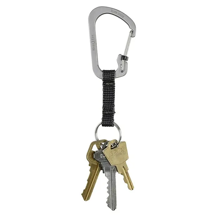 Nite Ize Karabinerhaken Slidelock Key Ring - Edelstahl, Silber - Schlüsselbund mit Nite Ize SlideLock Karabinerhaken. Der silberne Karabiner hält Schlüssel sicher und stilvoll zusammen. Praktisch für den Alltag.