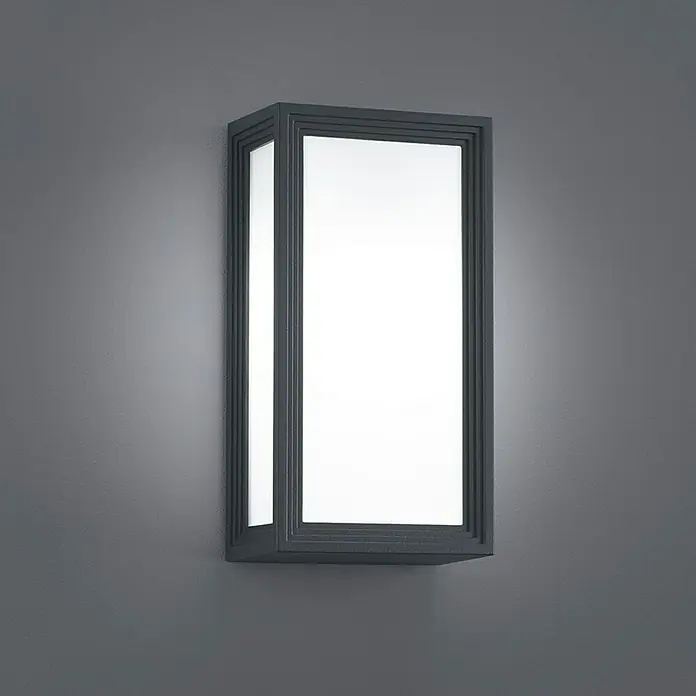 Trio Lighting Aplique de pared LED Timok - 6 W, L x An x Al: 10 x 15 x 28 cm, Negro, Blanco cálido - Un aplique rectangular de pared con un marco gris emite luz brillante, proporcionando una solución de iluminación moderna.