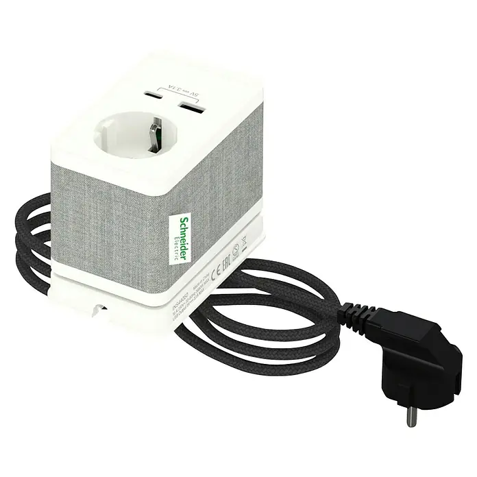 Schneider Electric New Unica Enchufe con USB de escritorio - Blanco/gris, 3,1 A - Primer plano de un adaptador de corriente Schneider Electric con puertos USB, con un diseño elegante recubierto de tela.