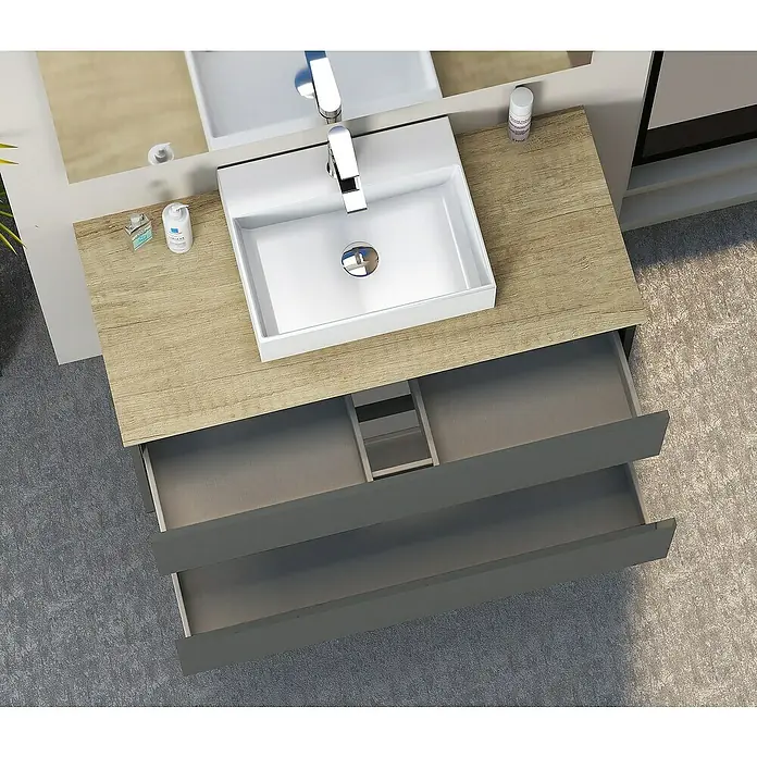 Artysan Mueble bajo de lavabo Fons - 46 x 90 x 56 cm, Antracita - Baño moderno con tocador y cajones abiertos para guardar artículos de baño. El tocador tiene aspecto de madera con un lavabo blanco encima.