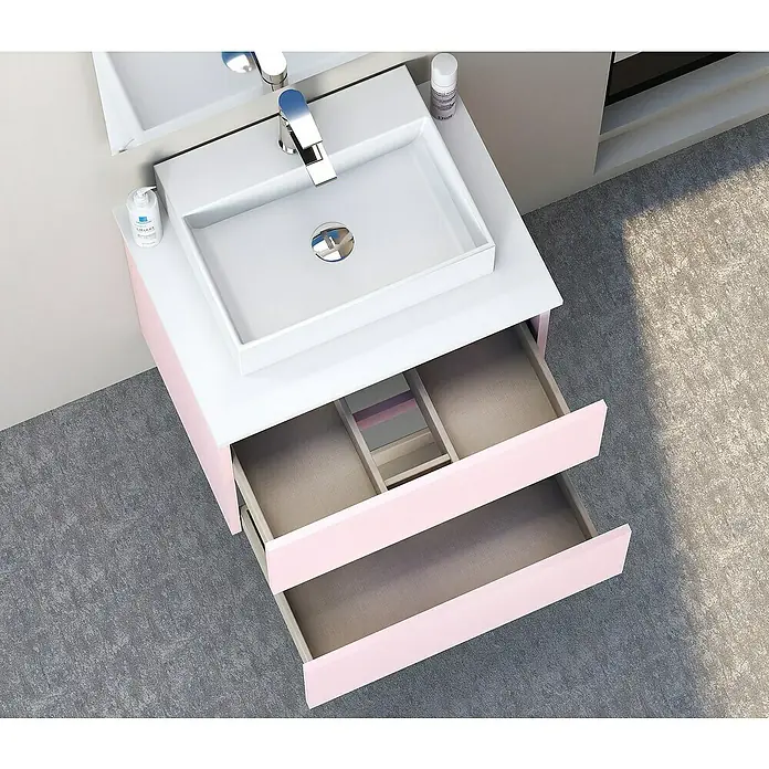 Artysan Mueble bajo de lavabo Fons - 39 x 50 x 56 cm, Rosa - Un tocador moderno con dos cajones abiertos en un baño, que combina almacenamiento y estilo. El tocador tiene un color rosa claro.