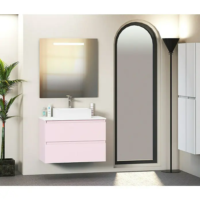 Artysan Mueble bajo de lavabo Fons - 46 x 70 x 56 cm, Rosa - Un moderno tocador de baño con gabinete rosa, espejo cuadrado y una puerta alta y delgada, que aporta un toque elegante al espacio.