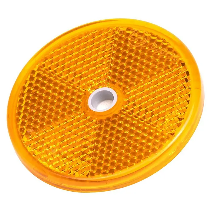 Stema Reflektor - Gelb - Reflektor in leuchtendem Orange. Ein kreisförmiger Reflektor mit Wabenmuster und zentraler Montageöffnung für verbesserte Sichtbarkeit.