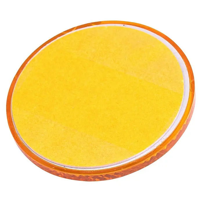 Stema Reflektor - Gelb - Gelbe runde Reflektorlinse mit orangefarbenem Gehäuse.