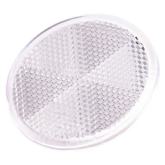 Stema Reflektor - Weiß, Länge: 60 mm - Nahaufnahme eines runden, klaren Reflektors mit einem einzigartigen, facettierten Design für verbesserte Sichtbarkeit.