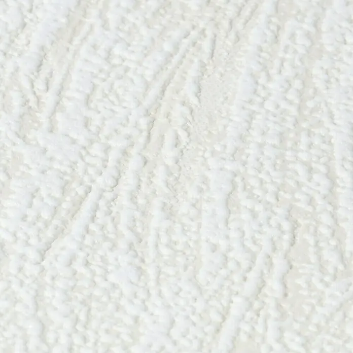 Rasch Vliestapete Putzstruktur - Creme, Uni, 10,05 x 0,53 m, Spachtelstruktur - Nahaufnahme einer strukturierten, weißen Oberfläche, die eine unebene und reliefartige Textur für dekorative Zwecke zeigt.
