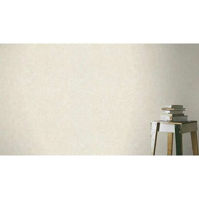 Rasch Factory 4 Vliestapete - Creme, Uni, 10,05 x 0,53 m - Aufnahme eines kleinen, farbenfrohen Tisches mit Büchern darauf, der durch sein schlichtes und dennoch charmantes Design besticht.