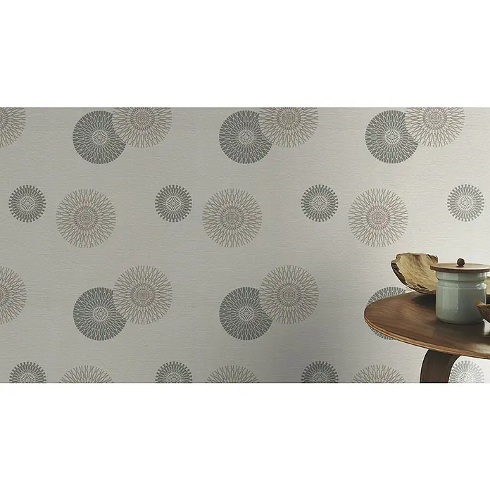 Rasch Tapetenwechsel Vliestapete - Grau, 10,05 x 0,53 m - Nahaufnahme einer Wand mit einem Muster aus grauen Kreisen, die ein elegantes und modernes Design schaffen.