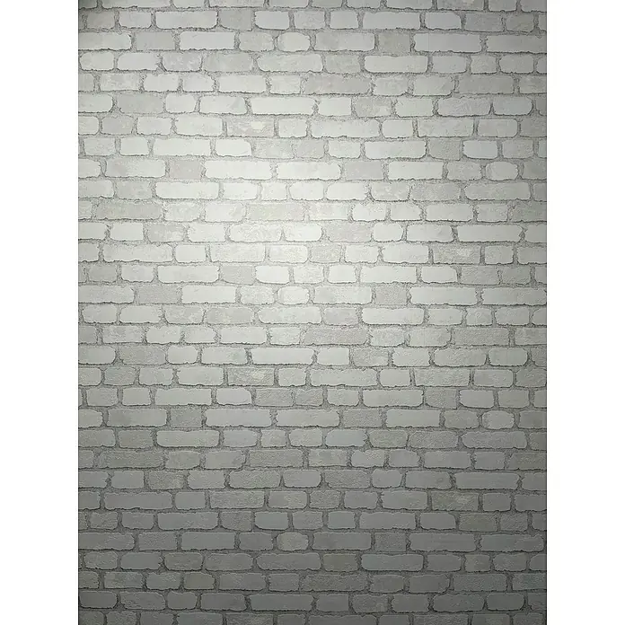 Marburg Sand & Stones Vliestapete Steinmauer II - Weiß, Steinoptik, 10,05 x 0,53 m - Graue Backsteinmauer mit unebener Textur. Die Wand zeigt ein modernes Design mit abgenutzten, verblichenen Ziegelsteinen und dunklen Fugen für ein elegantes Aussehen.